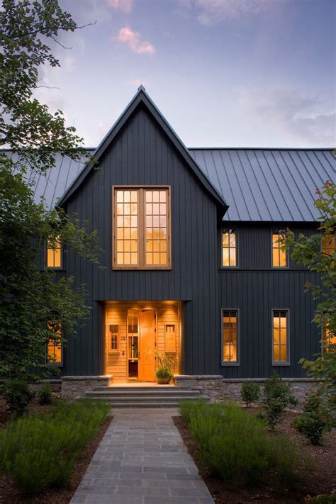 grey house black metal roof|grey house with black awnings.